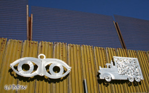 Metal artwork on the old border wall in Nogales, Mexico