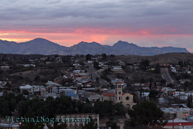 rain clouds and pink skies over Nogales, Arizona