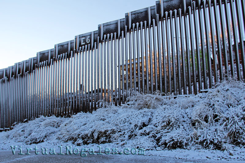 Snow on the the Mexico border wall that bisects Ambos Nogales